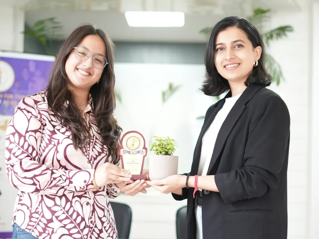 Devishi Uniyal receiving an achievement award during her student journey
