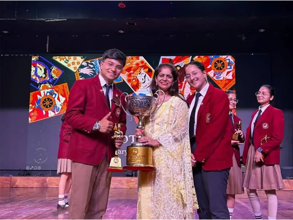 Devishi Uniyal receiving an achievement award during her student journey